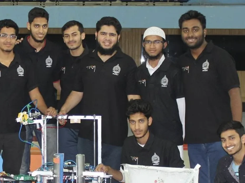 Shaikh Simraan with Team Robocon MJCET and their competition robot at a national robotics competition in India